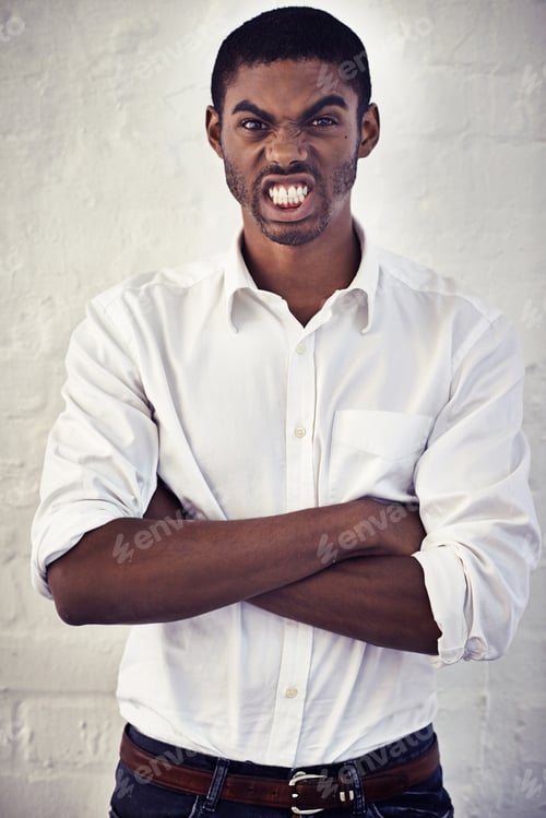 Preview: Ive had just about enough. Shot of a serious young man standing with his arms crossed.