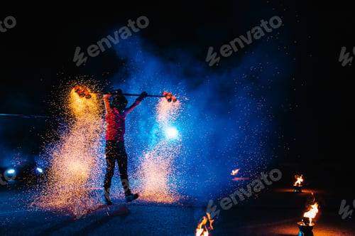 Preview: Fire show, dancing with flame, male master juggling with fireworks, performance outdoors, draws