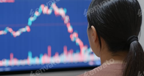 Preview: Woman watching the stock market graph