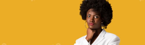 Preview: panoramic shot of curly african american girl looking at camera isolated on orange