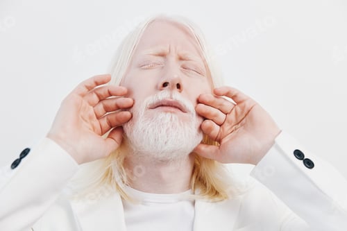 Preview: serene man with long white hair and beard, eyes closed, expressing peacefulness against a white
