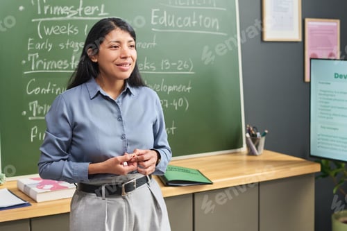 Preview: Young Adult Hispanic Woman Teaching in Classroom during Educational Presentation