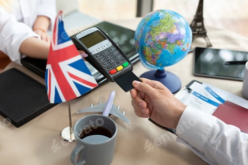 Preview: Close-up payment of tickets at a travel agency through a bank terminal