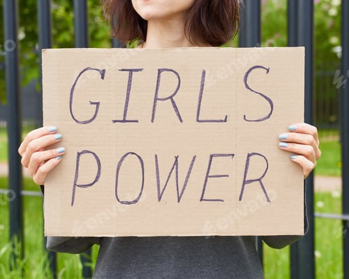 Preview: Woman Holds Girls Power Sign in the City