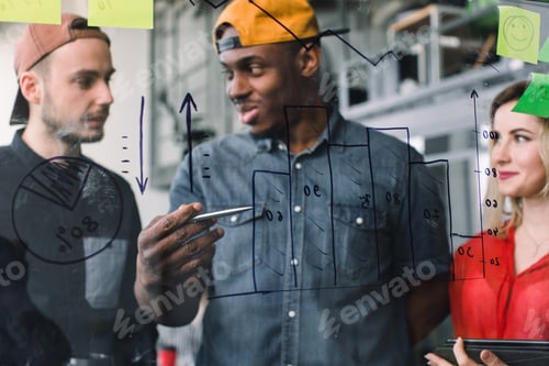 Preview: Creative group of three multiethnical business people freelancers brainstorming on glass wall in