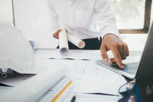 Preview: Architect or engineer working in office