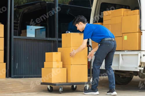 Preview: Asian delivery man, delivery men unloading cardboard boxes from truck.