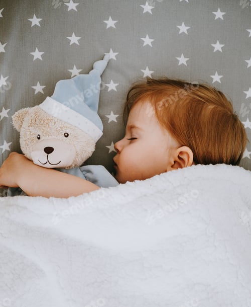 Preview: Little baby girl sleeping with her bear toy.