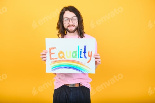 Preview: Hands of gay man holding lgbt banner on rainbow flag background lgbt symbol