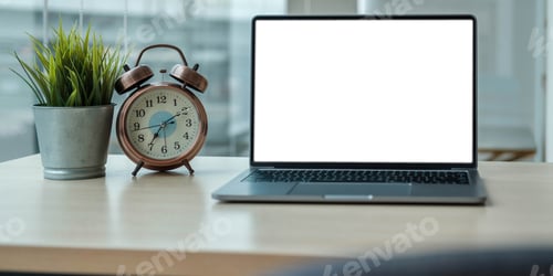 Preview: Modern office desk with open laptop computer white screen mockup, financial and marketing report