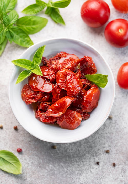 Preview: Bowl with sun dried tomatoes with fresh herbs and spices.