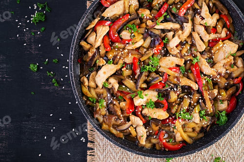 Preview: Stir fry with chicken, eggplant, zucchini and sweet peppers - Chinese food. Top view, above