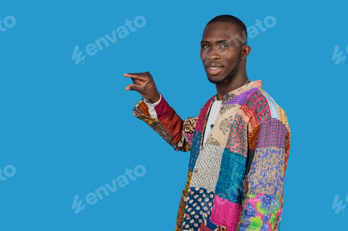 Preview: Stylish african man gesturing small size with fingers on blue background