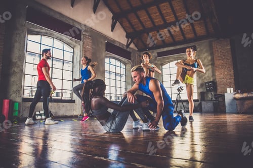 Preview: Athletes training in a gym