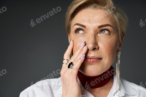 Preview: Stylish woman posing in a white shirt indoors