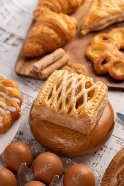 Preview: Various breads and eggs on red white cloth. Selective focus.
