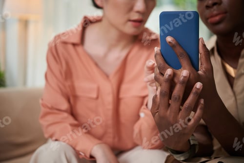 Preview: Woman Showing Friend Mobile App