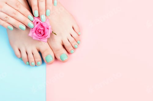Preview: Female hands, legs with manicure and pedicure with flower on a pink, blue background, top view