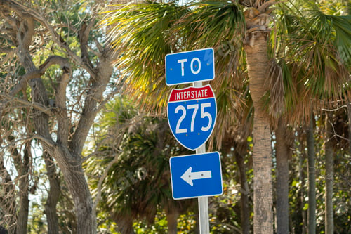 Preview: Blue directional road sign indicating direction to I-275 freeway interstate