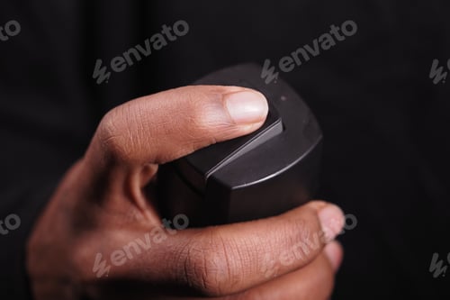 Preview: Hand holding a body spray closeup