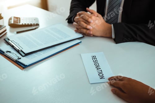 Preview: Male employee handed out a resignation envelope to the manager.