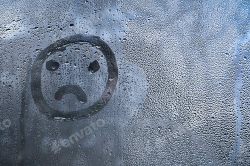 Preview: condensation on glass forming abstract background with sad face