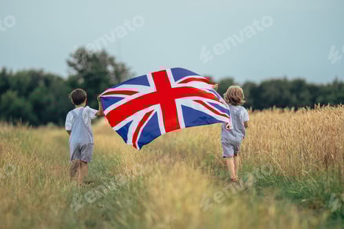 Preview: Little Boys British Patriot Kids Running With National Flag On Countryside Road.