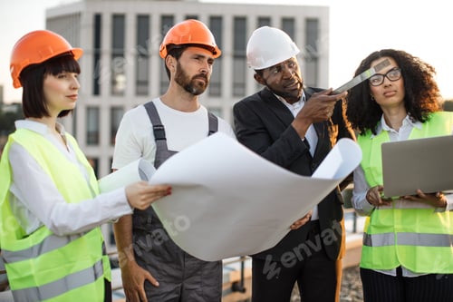 Preview: Multiracial architects discussing construction diagram