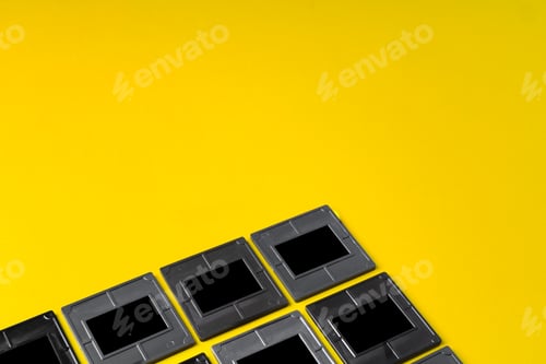 Preview: Photography empty slide frames on yellow background