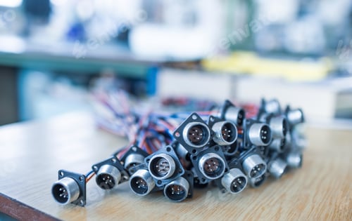 Preview: Close-up blurry metal sockets for plugs are in a heap