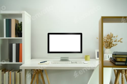 Preview: Front view of blank computer screen on white table in modern home office