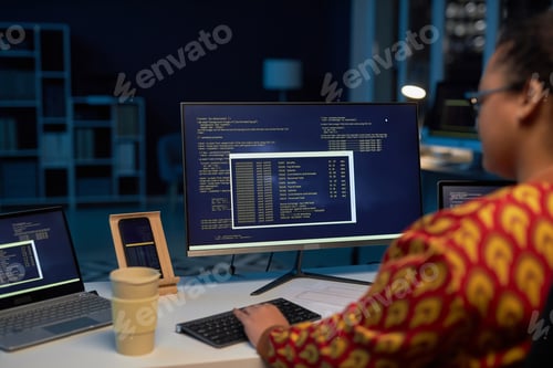 Preview: Female programmer typing computer codes on computer