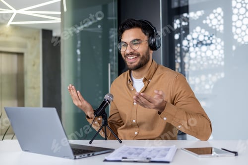 Preview: Hindu business trainer uses professional microphone to record online video webinar course, man