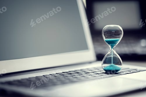 Preview: Hourglass on laptop computer concept for time management