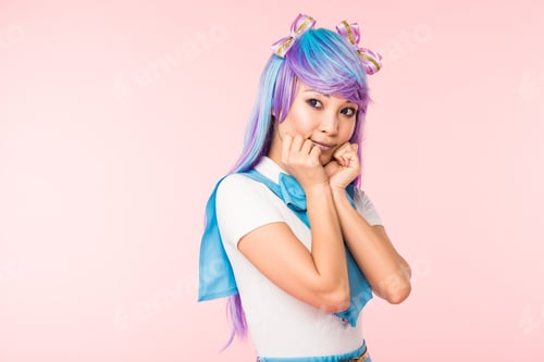 Preview: Pretty asian anime girl in purple wig posing isolated on pink