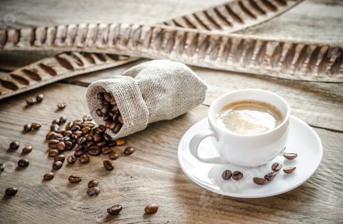 Preview: Cup of coffee with coffee beans