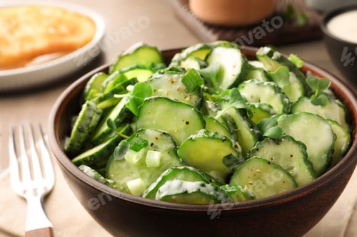 Preview: Delicious cucumber salad on wooden table, closeup