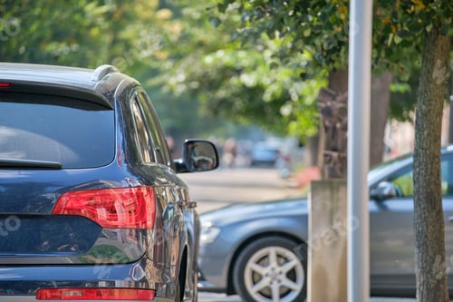 Preview: Close up of a car parked illegally against traffic rules on pedestrian city street side.