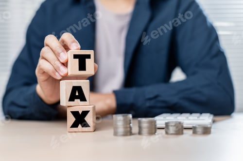 Preview: Wooden blocks spelling tax with coins and calculator on table