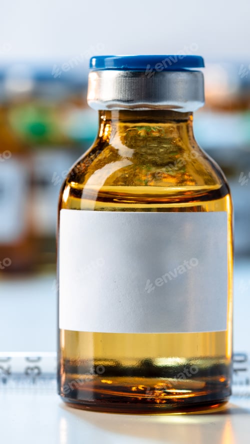 Preview: Clear glass vial filled with liquid medicine on a lab table during a research session