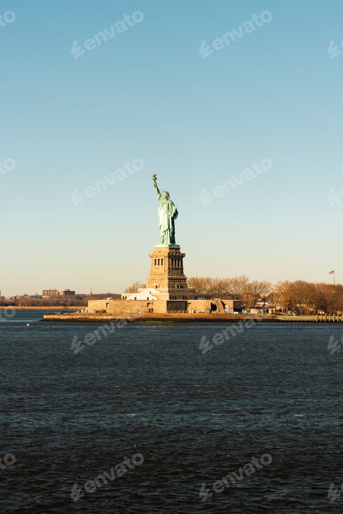 Preview: Iconic Statue of Liberty against a clear blue sky in New York City.