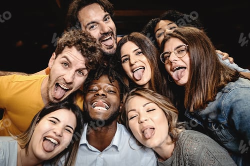 Preview: Portrait of happy friends embracing and making grimaces looking at the camera
