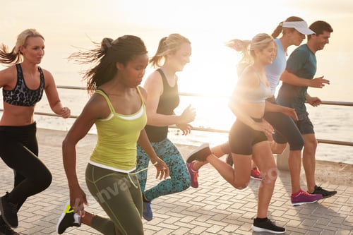 Preview: Healthy young people running race on seaside promenade