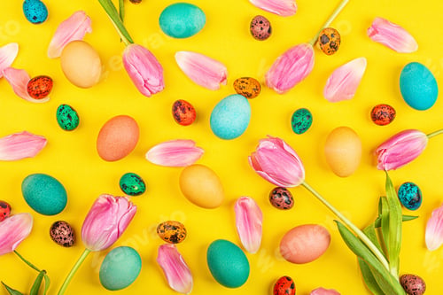 Preview: Flat Lay of Colored Easter Eggs on Yellow Background