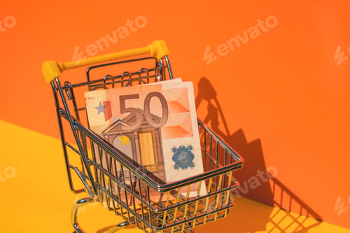 Preview: Euro paper currency 50 banknote money Shopping trolley cart on colorful orange yellow background