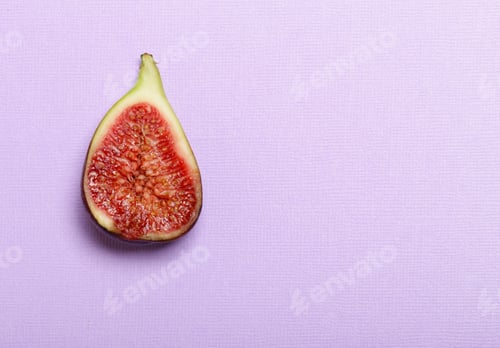 Fresh Fig Fruit Cut in Half on Background