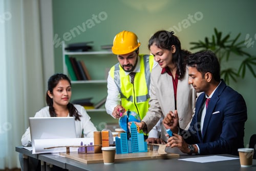 Preview: Indian asian Architect, builder and engineer in a team meeting discussing construction projects