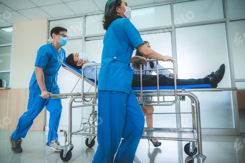 Preview: Emergency department, doctors and surgeons team move seriously injured patient lying