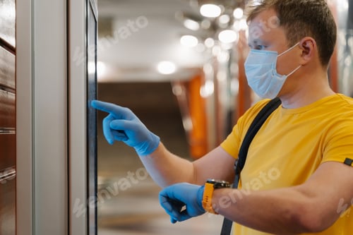 Preview: Man checks time on watch, uses touch screen in protective rubber gloves