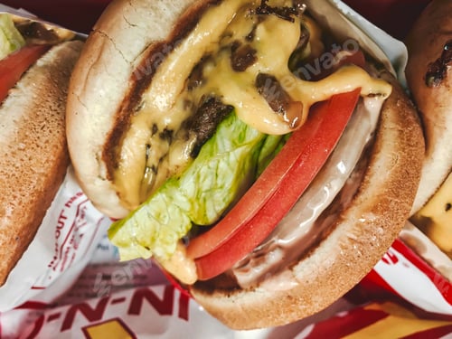Juicy Cheeseburger with Fresh Vegetables and Melted Cheese